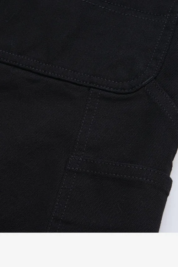 Pantaloncini con rinforzo su un solo ginocchio Pantaloncini con rinforzo su un solo ginocchio